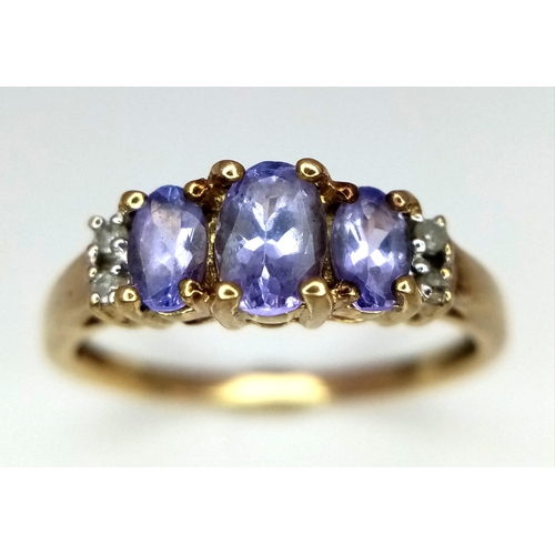 891 - 9kt Yellow Gold Diamond & Iolite Ring.
W: 2.4g
Size Q