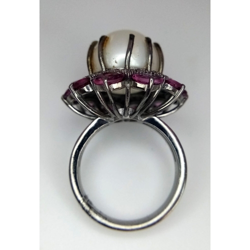 1130 - A Freshwater Pearl Ring with Diamond and Rhodolite Surround. 925 silver. Size M. 12ct pearl, 3ctw rh... 