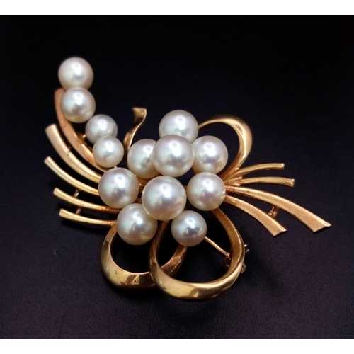 207 - 14k yellow gold cultured pearl brooch with 13 cultured pearls varying from 5mm-8mm. 14.9g weight.