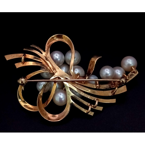 207 - 14k yellow gold cultured pearl brooch with 13 cultured pearls varying from 5mm-8mm. 14.9g weight.