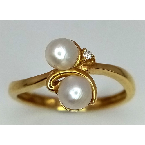 228 - An 18k yellow gold diamond and pearl ring. 2.4g total weight.  size L 1/2 (pearls: 2mm/dia:0.01ct).