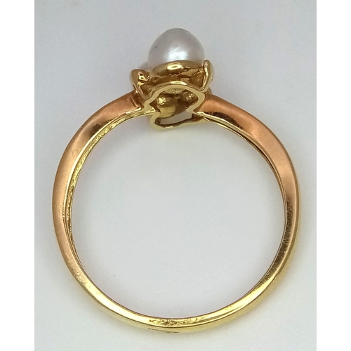 228 - An 18k yellow gold diamond and pearl ring. 2.4g total weight.  size L 1/2 (pearls: 2mm/dia:0.01ct).