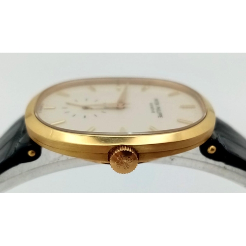 65 - A Vintage Patek Phillipe 18K Gold Gents Watch. Original black leather strap with 18k gold buckle. 18... 