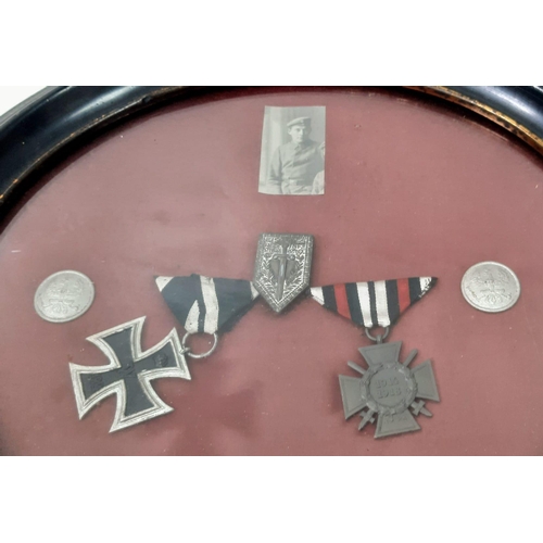 524 - Framed WW1 Imperial German Iron Cross 2nd class and Hindenburg Field Service Cross, along with a pho... 