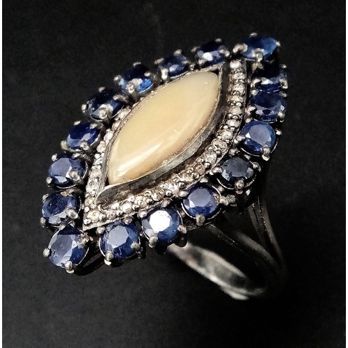 1115 - A Marquise Cut Australian Fire Opal Ring, with a Halo of  Diamonds and Kyanite. 925 Silver. Size N. ... 