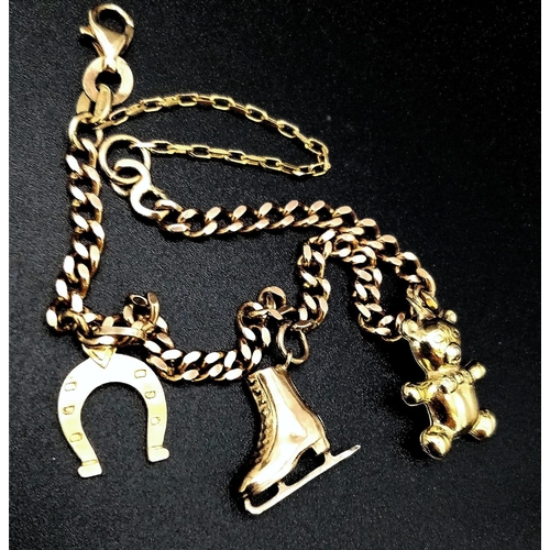 314 - Beautiful 9K Solid Curb Bracelet with Safety Chain. Features 3 Gold Charms: Teddy, Ice Skate & Lucky... 