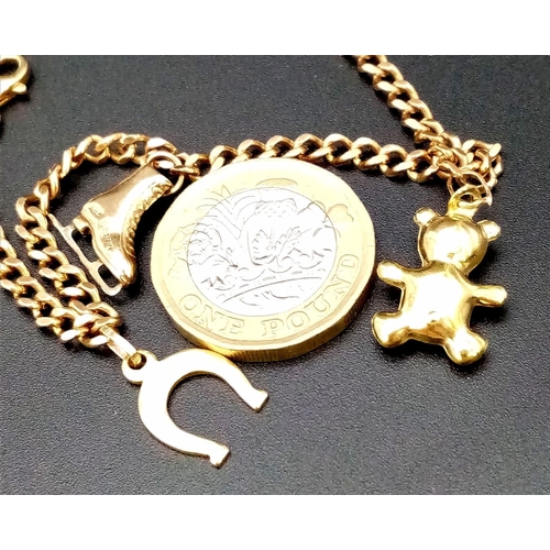 314 - Beautiful 9K Solid Curb Bracelet with Safety Chain. Features 3 Gold Charms: Teddy, Ice Skate & Lucky... 