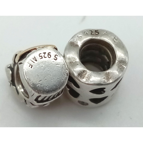 964 - Two Sterling Silver Pandora charms flower bouquet. Engraved 'LOVE' and open work love hearts. Wt 5.2... 