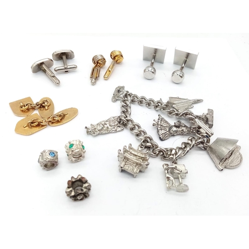 1096 - Selection of assorted items.
Featuring 4 pairs of fancy cufflinks, 3 Pandora style charms and a Char... 