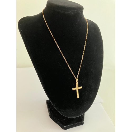 14 - A vintage 9 carat YELLOW GOLD CROSS and CHAIN. Both pieces having full UK hallmark. Gold cross 3.5 c... 