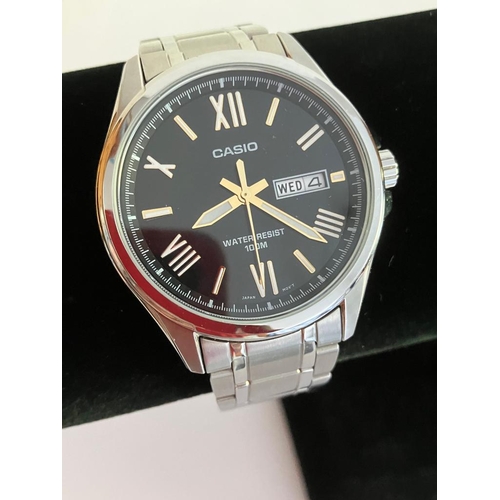 175 - Gentlemans CASIO QUARTZ WRISTWATCH MTP 1377.  Day/Date model finished in stainless steel silver tone... 