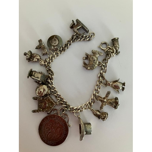 189 - Vintage SILVER CHARM BRACELET Full of silver charms to include donkey, windmill, penguin,cuckoo cloc... 