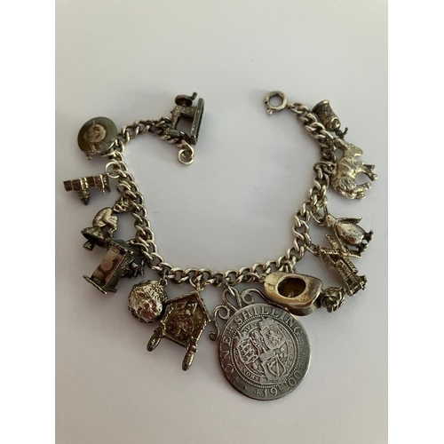 189 - Vintage SILVER CHARM BRACELET Full of silver charms to include donkey, windmill, penguin,cuckoo cloc... 