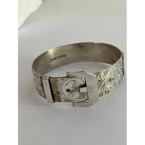 413 - SILVER BUCKLE BRACELET in the form of a Belt with Adjustable Buckle. Attractive chased design. Full ... 