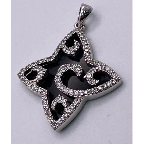 1022 - Sterling silver stone set fancy star shaped pendant. Wt 7.3g.