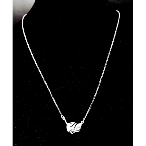 1066 - An Alex Monroe silver feather necklace on 18 inch adjustable chain. 2.5g.