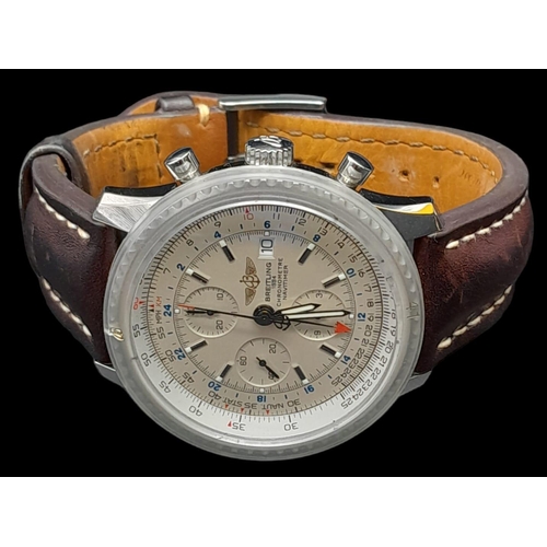 11 - A Breitling Navitimer World Automatic Gents Watch. Brown leather strap. Stainless steel case - 47mm.... 