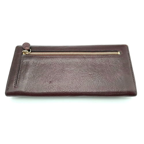 1125 - Burgundy Brown Mulberry Purse.
Quality soft leather with typical Mulberry high standards.
Multiple c... 