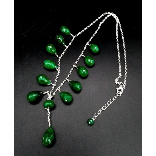 1144 - A 925 Silver Necklace with Briolite Cut Emerald Drops.
44cm in length, 5.5cm middle drop, 77ctw emer... 