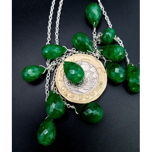 1144 - A 925 Silver Necklace with Briolite Cut Emerald Drops.
44cm in length, 5.5cm middle drop, 77ctw emer... 