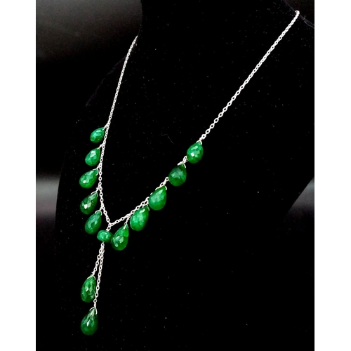 1144 - A 925 Silver Necklace with Briolite Cut Emerald Drops.
44cm in length, 5.5cm middle drop, 77ctw emer... 