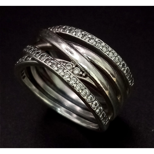 1161 - Sterling silver wavey stone set band ring. Wt 6.5g, size M/N.