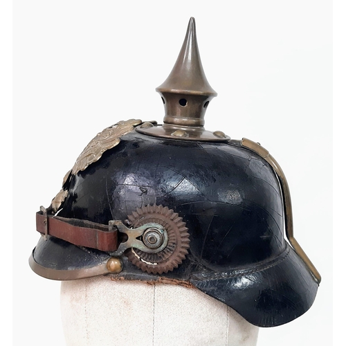 124 - An Imperial German/Prussian 1897 Pickelhaube with brown NCO’s chinstrap and cockades.