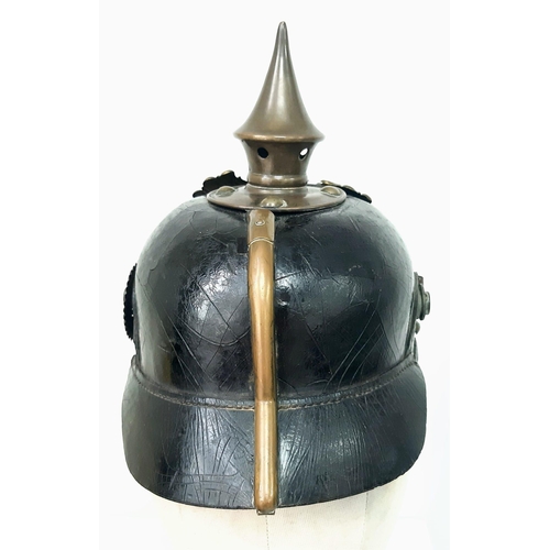 124 - An Imperial German/Prussian 1897 Pickelhaube with brown NCO’s chinstrap and cockades.