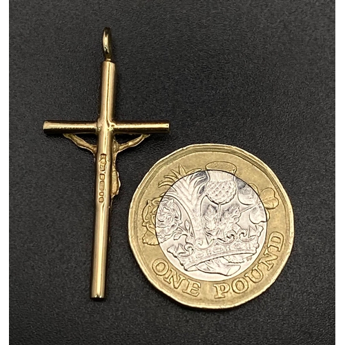 30 - A 9K GOLD CRUCIFIX .   2.5gms   4cms