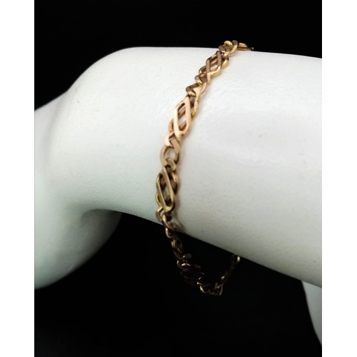 37 - A 9K GOLD INTERLINK BRACELET .   5.9gms   19cms