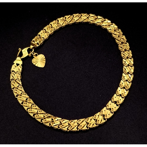 66 - A 22K GOLD ASIAN STYLE BRACELET WITH HEART PENDANT .    11.2gms