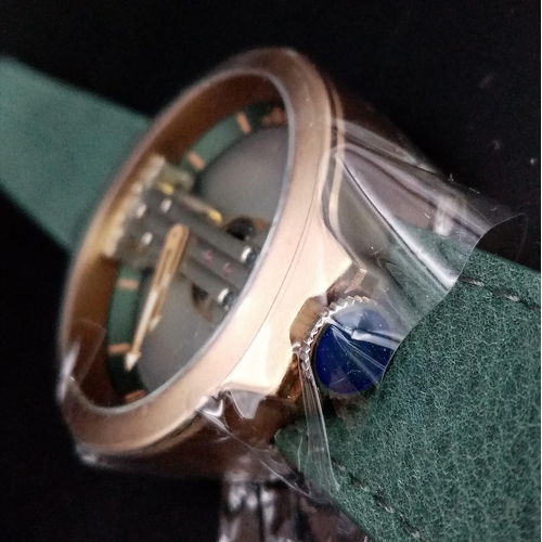 787 - A Verticale Mechanical Gents Watch. Green leather strap, Gilded open case -42mm. Top winder. As new,... 