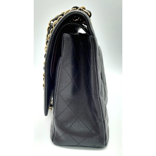 8 - Chanel Maxi Double Flap Caviar Black Bag.
The Maxi double flap bag is one of the largest sizes from ... 