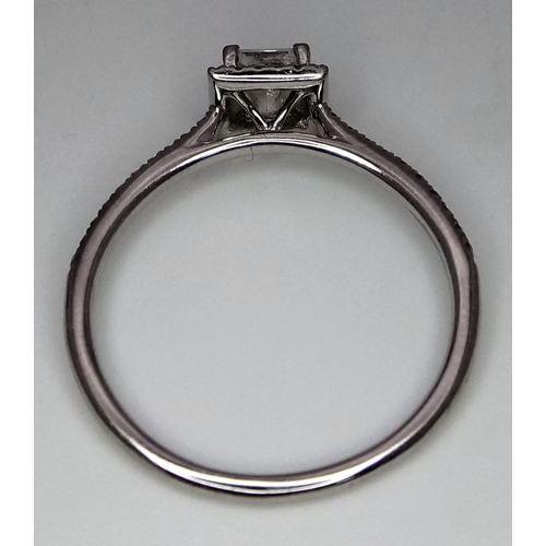 136 - A platinum ring with a princess cut diamond (0.7 carats appr.) and round cut diamonds on the halo an... 