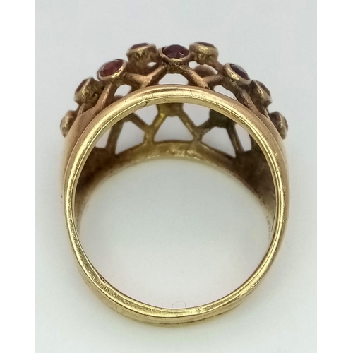 157 - ANTIQUE 9K GOLD RING WITH GARNET STONES SET INTO FILIGREE DESIGNED RING FACE .  5.2gms   size N