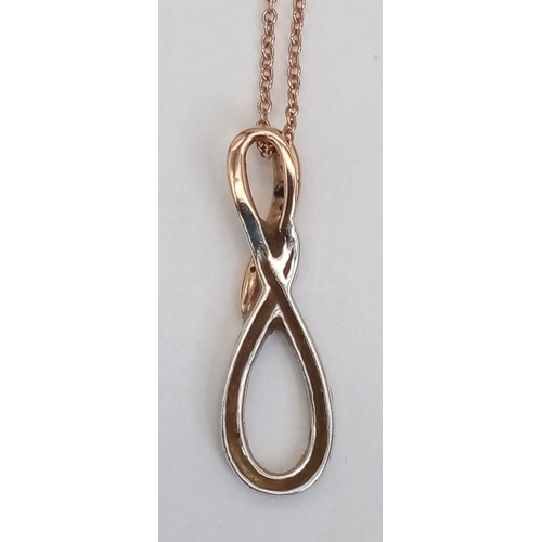 184 - A 9K ROSE AND WHITE GOLD PENDANT WITH DIAMOND ENCRUSTING ON A 46cms 9K ROSE GOLD CHAIN .  3.7gms