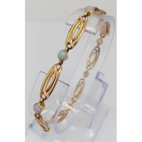 186 - A vintage ART NOUCEAU 15 K yellow gold bracelet adorned with round opal cabochons. Length: 19 cm, we... 