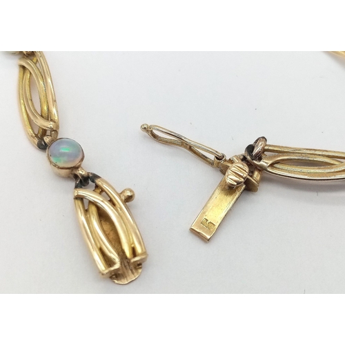 186 - A vintage ART NOUCEAU 15 K yellow gold bracelet adorned with round opal cabochons. Length: 19 cm, we... 