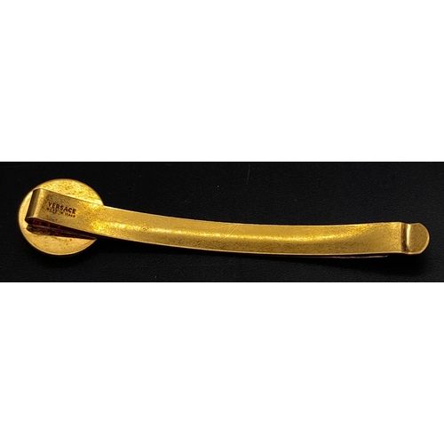 Sold at Auction: A genuine VERSACE gold plated tie holder. Length
