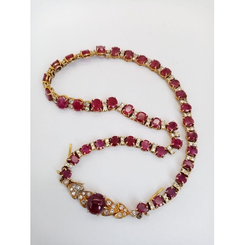 53 - A vintage, 9 K yellow gold necklace loaded with oval cut natural rubies and round cut diamonds. Leng... 