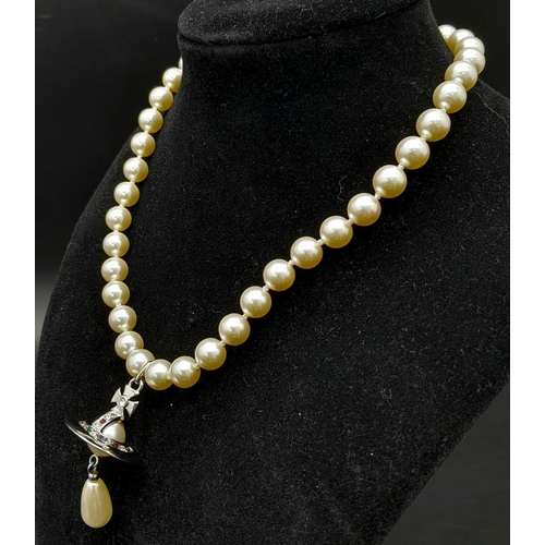 562 - A Vivienne Westwood Cultured Pearl Necklace with Drop Pendant. 38cm length. Comes with original VW p... 