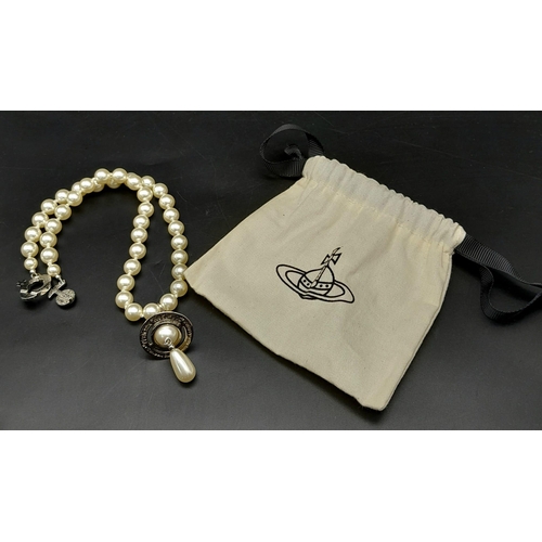 562 - A Vivienne Westwood Cultured Pearl Necklace with Drop Pendant. 38cm length. Comes with original VW p... 