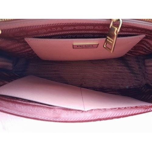 78 - A Prada Two-Tone Pink Galleria Bag. Saffiano leather exterior. Features expandable side wings with p... 