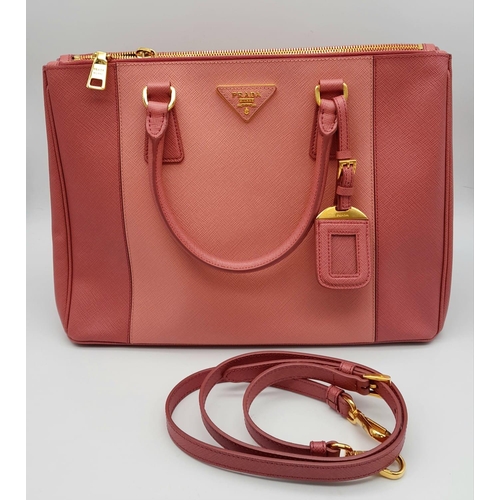 78 - A Prada Two-Tone Pink Galleria Bag. Saffiano leather exterior. Features expandable side wings with p... 