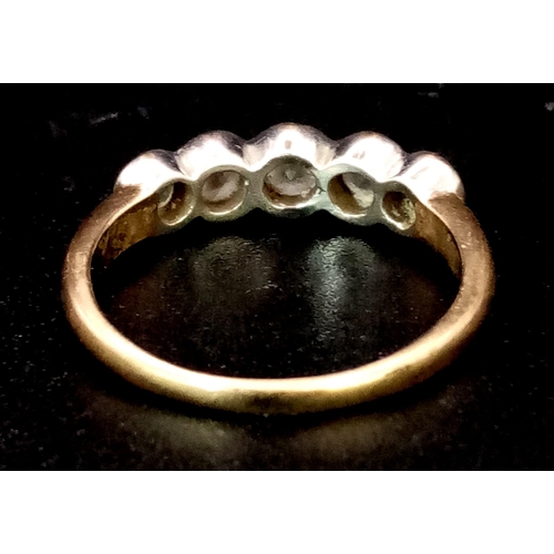 93 - A VINTAGE 9K GOLD RING HAVING 5 DIAMONDS SET IN PLATINUM .  2.45gms   size N