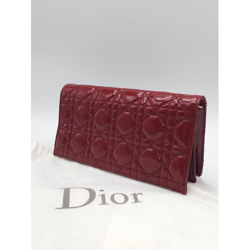 206 - A Christian Dior Red 'Lady Dior' Bag. Cannage quilted patent leather exterior. Magnetic closure, sil... 