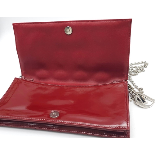 206 - A Christian Dior Red 'Lady Dior' Bag. Cannage quilted patent leather exterior. Magnetic closure, sil... 