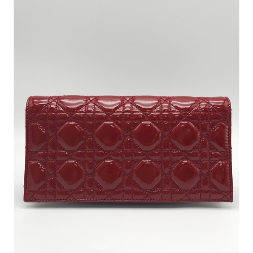 206 - A Christian Dior Red 'Lady Dior' Bag. Cannage quilted patent leather exterior. Magnetic closure, sil... 