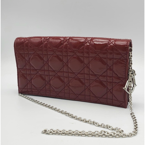 206 - A Christian Dior Red 'Lady Dior' Bag. Cannage quilted patent leather exterior. Magnetic closure, sil... 