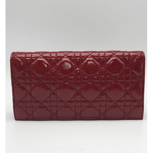 206 - A Christian Dior Red 'Lady Dior' Bag. Cannage quilted patent leather exterior. Magnetic closure, sil... 